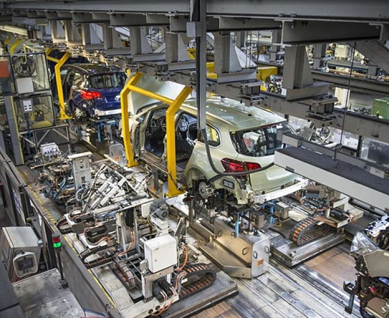 Car bodies being connected with engines and suspension in car factory